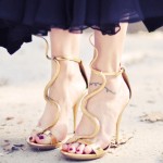 You won’t believe how much these gold snake heels cost.