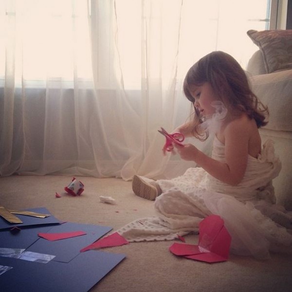 Mayhem creating her paper dresses.